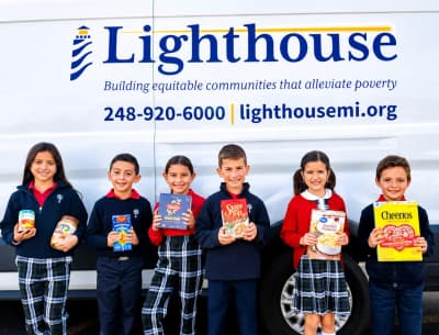 Holy Family Regional School students participating in a community food drive in Rochester Hills.