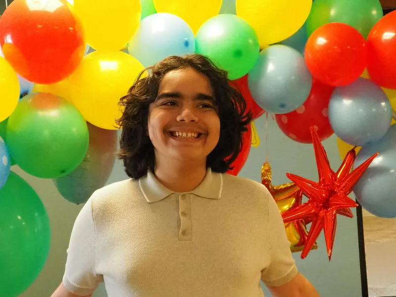 A student celebrating at school at New Horizon Center for Children & Adults with Disabilities