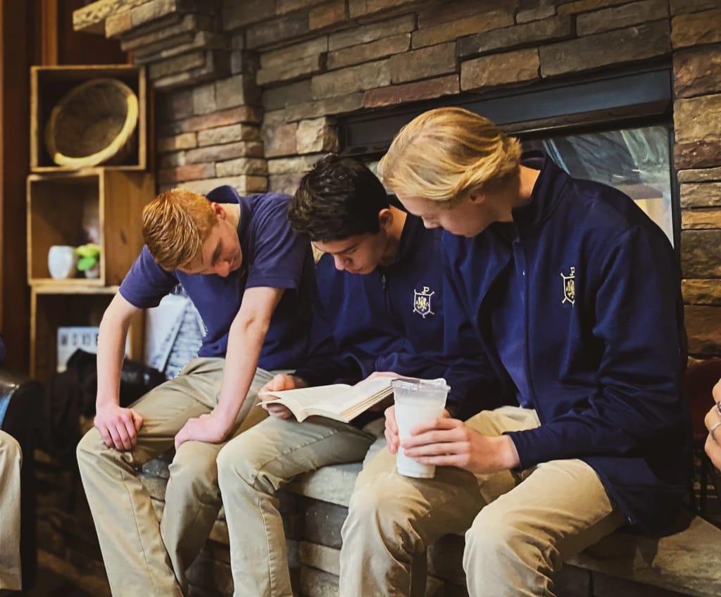 The Ambrose School students working together in a classroom.