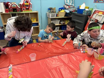 Kids Connect USA students making crafts at a classroom table
