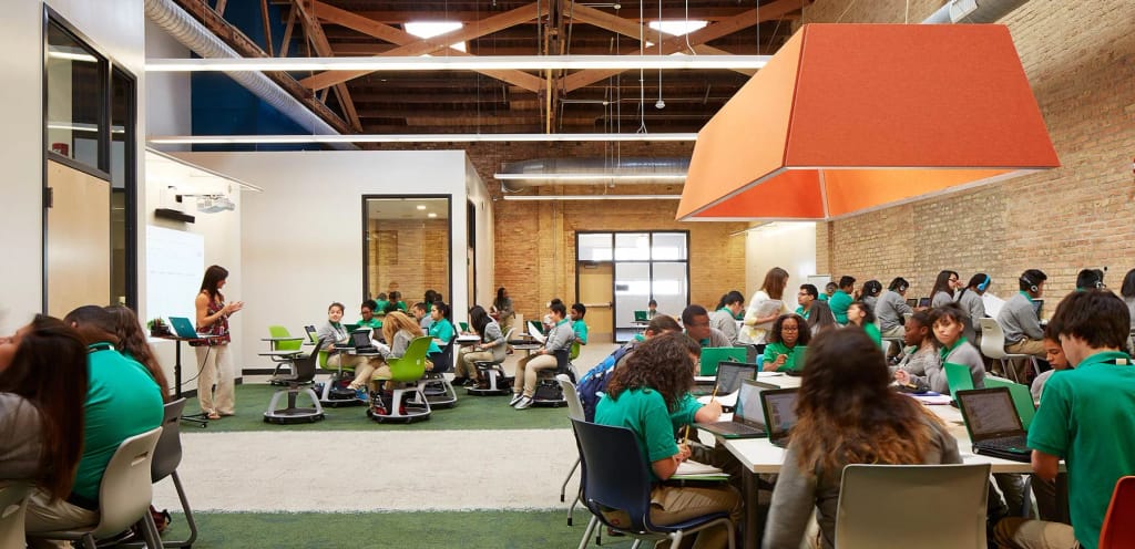 Students gathered in the open learning space at Intrinsic Downtown Campus 1