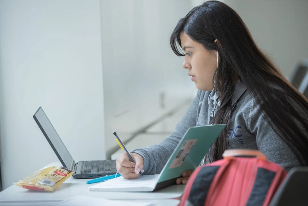 A student working independently on campus at Intrinsic Downtown Campus 1