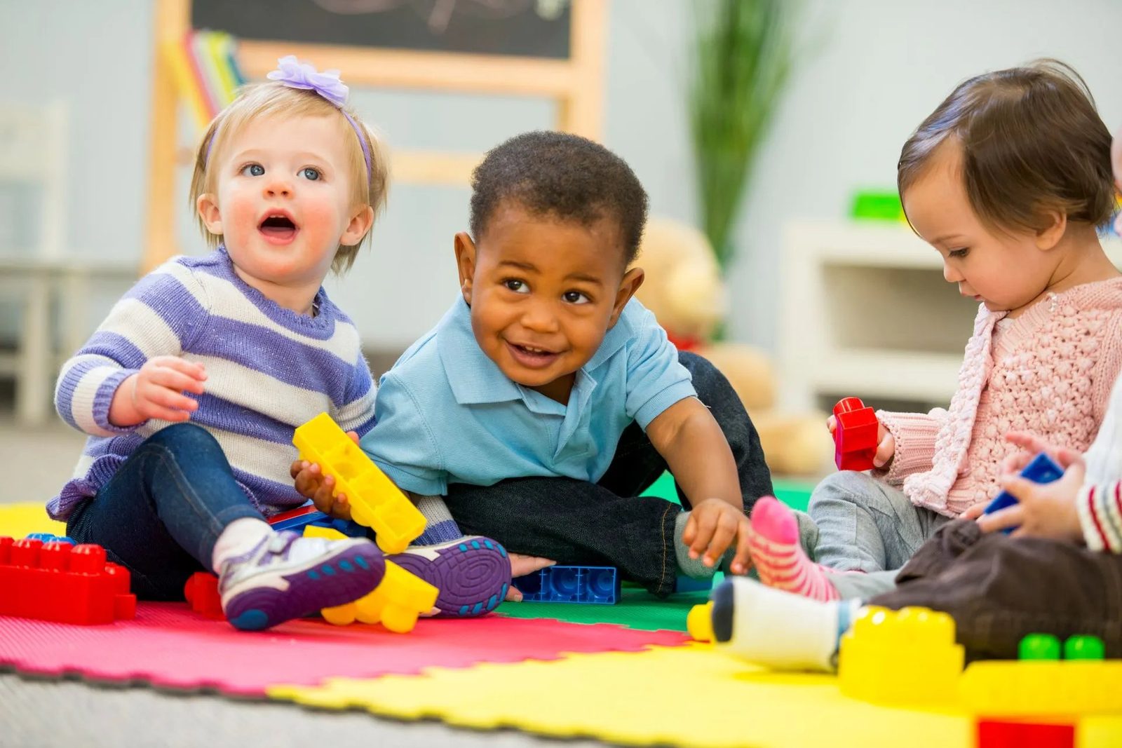Toddlers playing with blocks