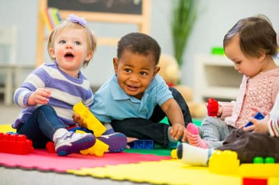 Toddlers playing with blocks