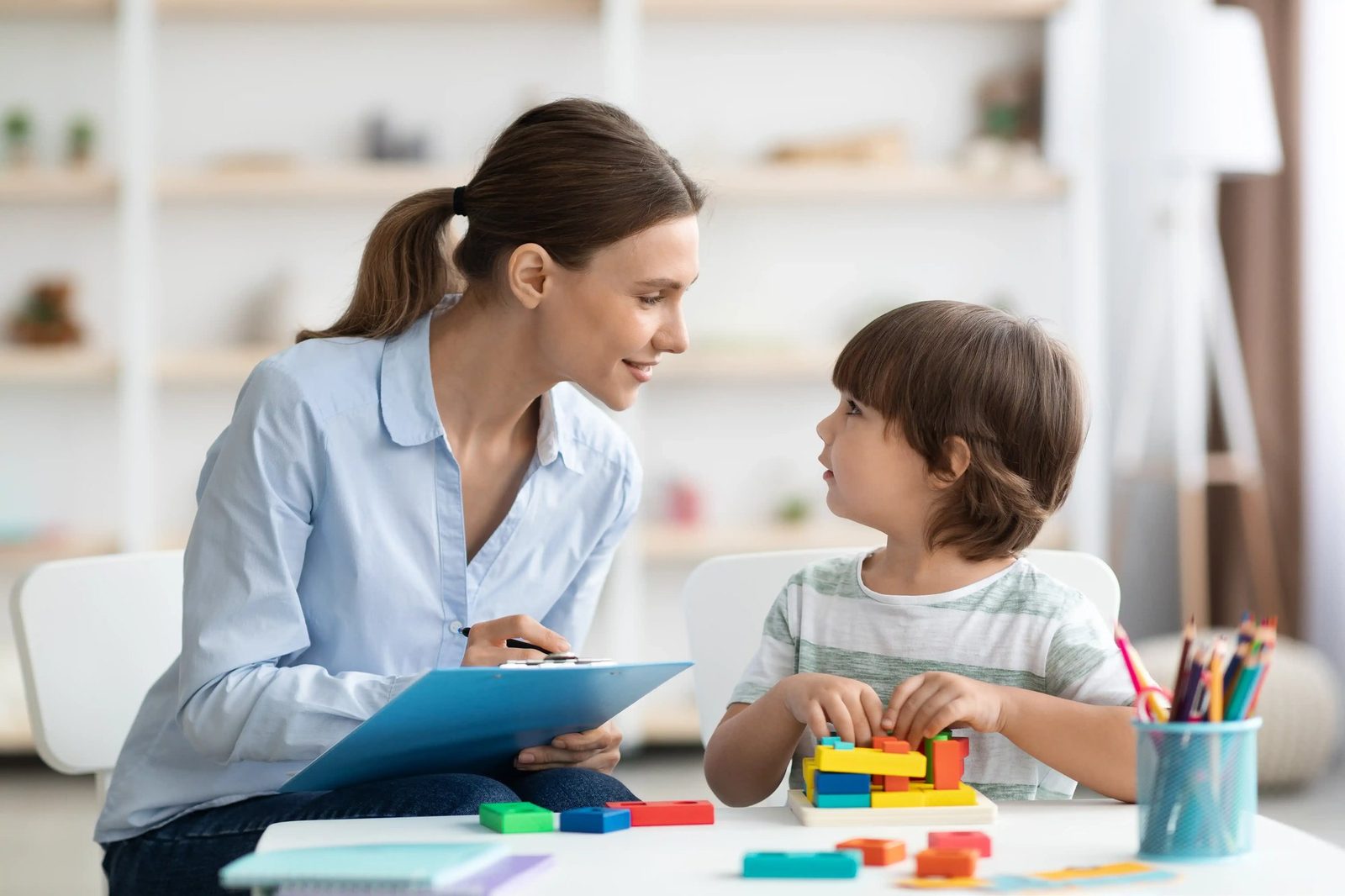 Psychologist working with a young boy
