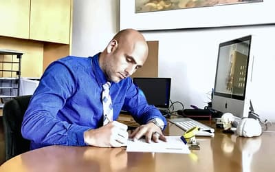 Dr. Gerard Chambers at desk