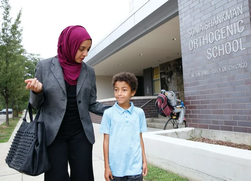 A student arriving at the school entrance at Sonia Shankman Orthogenic School