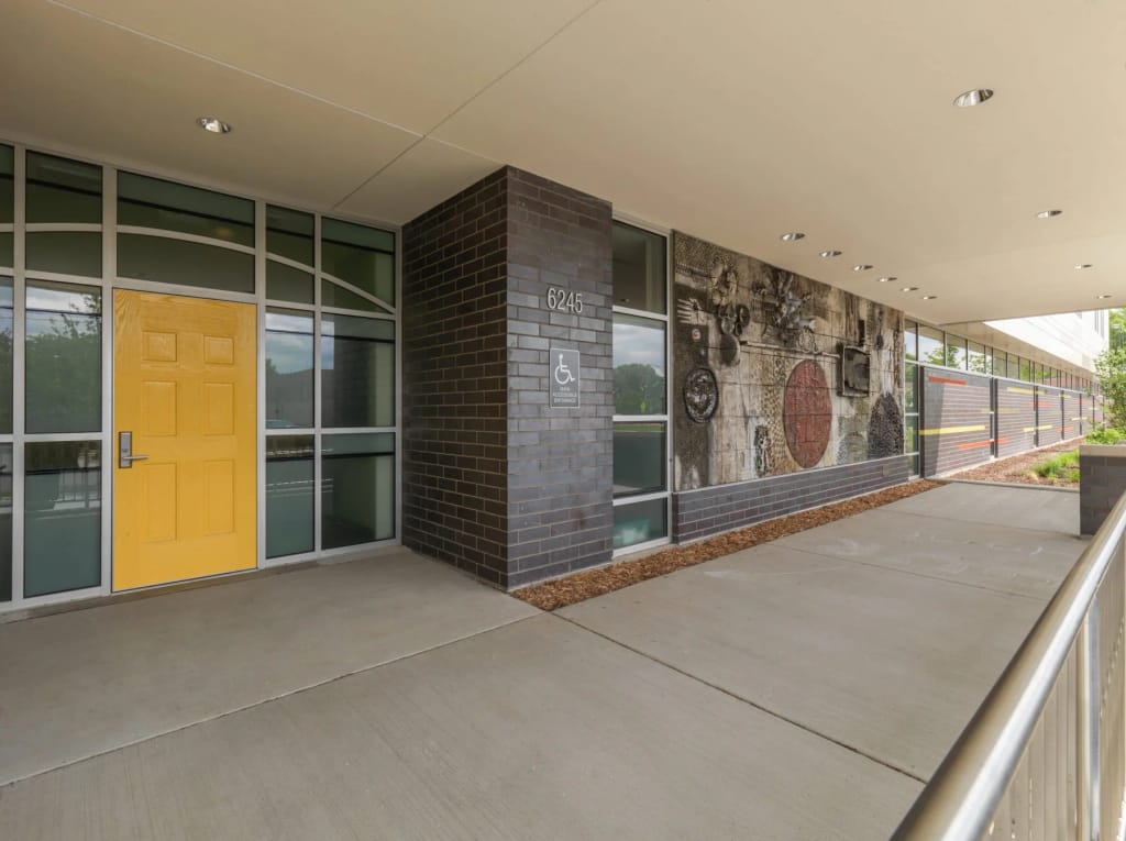 The school building and yellow entrance at Sonia Shankman Orthogenic School