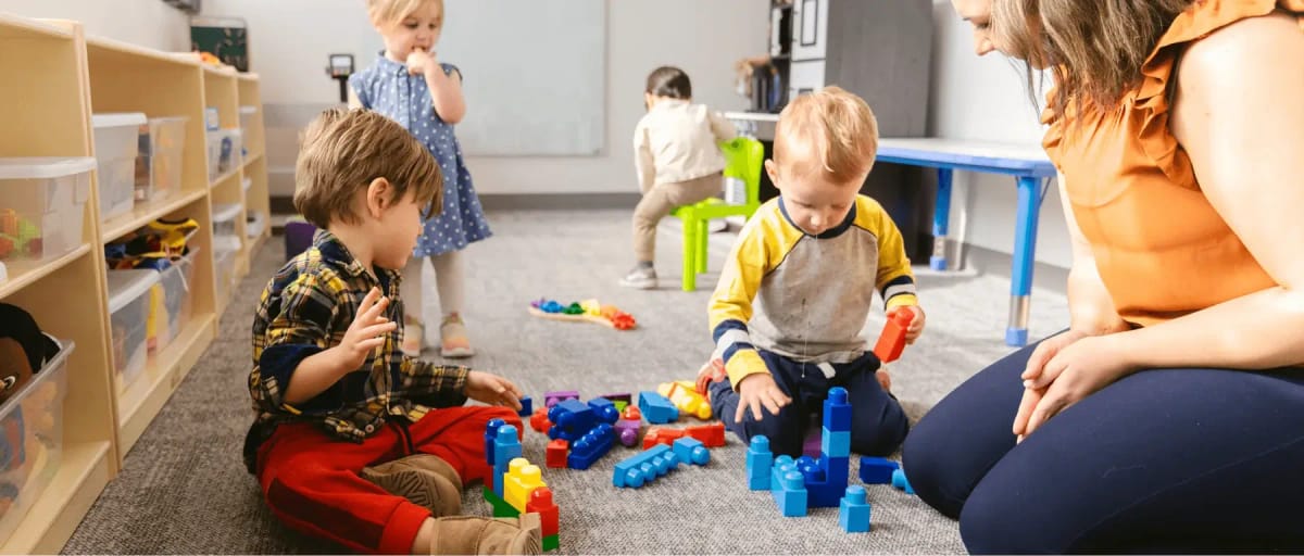 Children and adults taking part in a therapy activity together