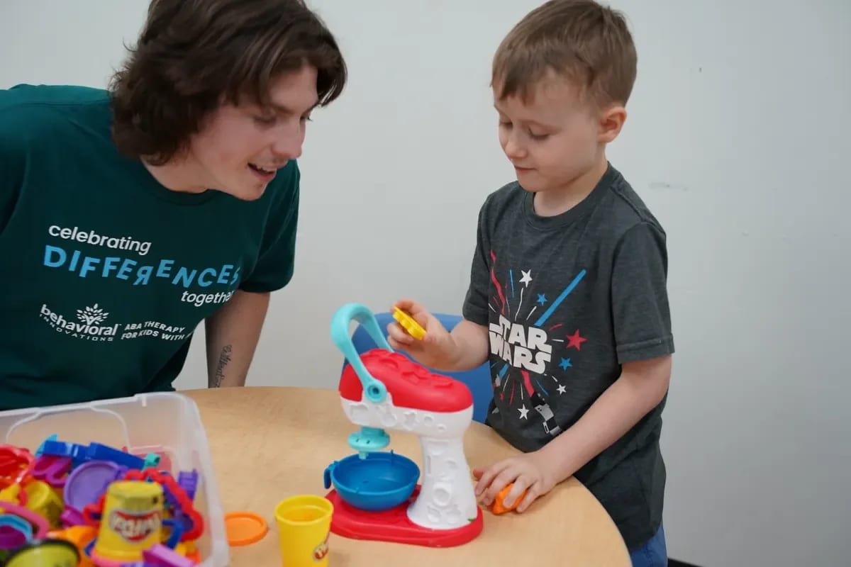 Provider-published image of a child and therapy staff