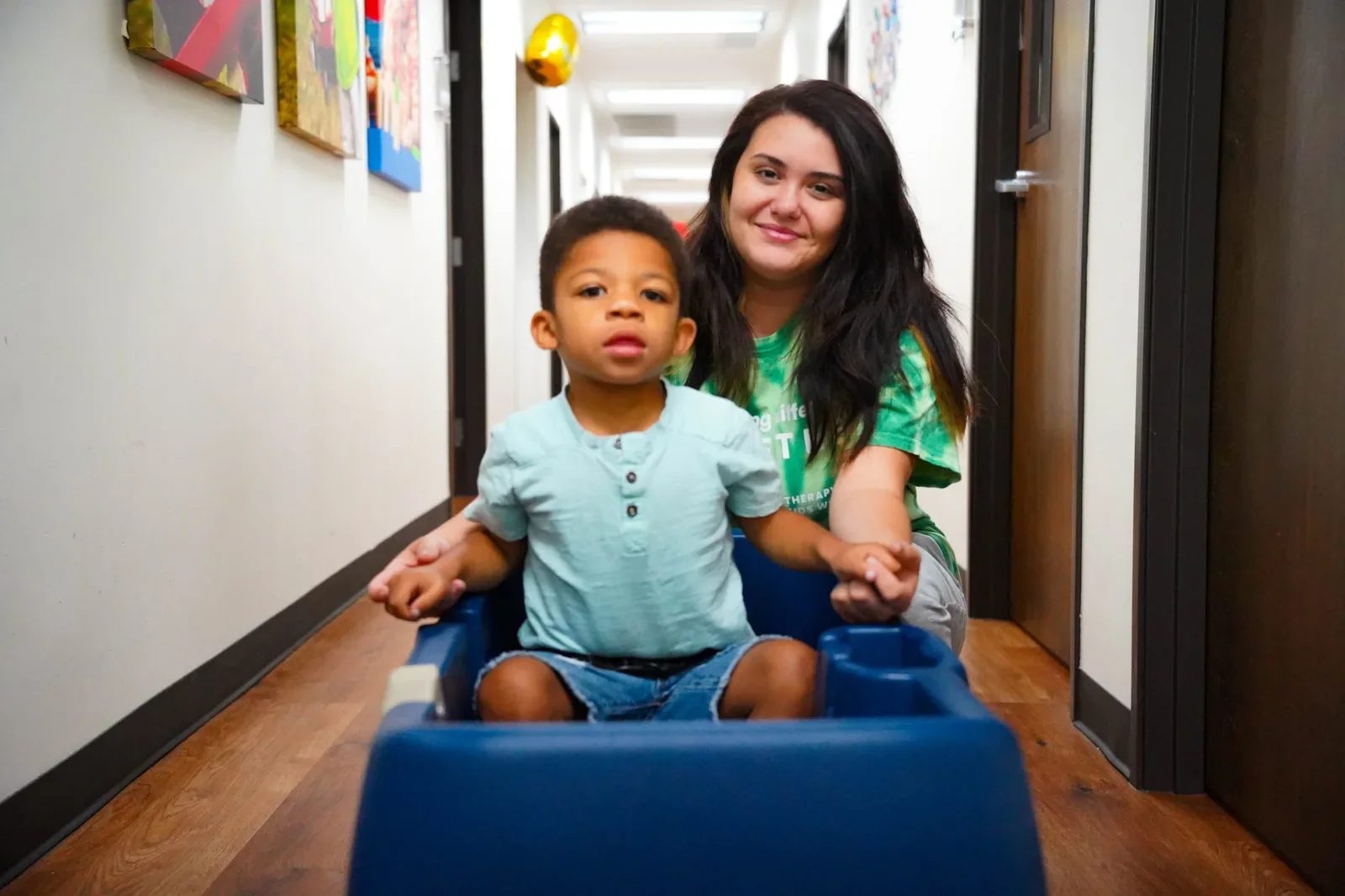 Provider-published image of a child and therapy staff
