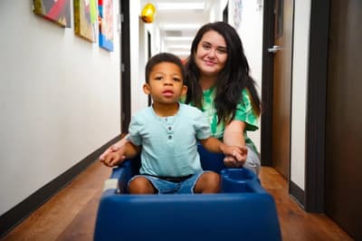 Provider-published image of a child and therapy staff