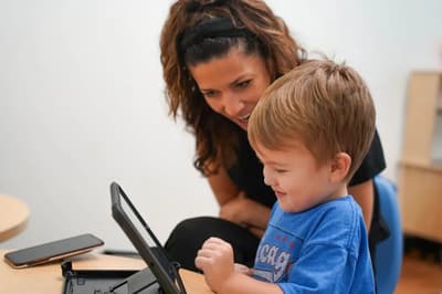 Provider-published image of a child and therapy staff