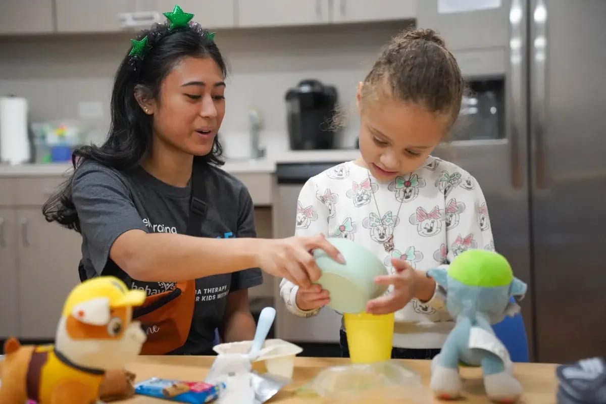 Provider-published image of a child and therapy staff