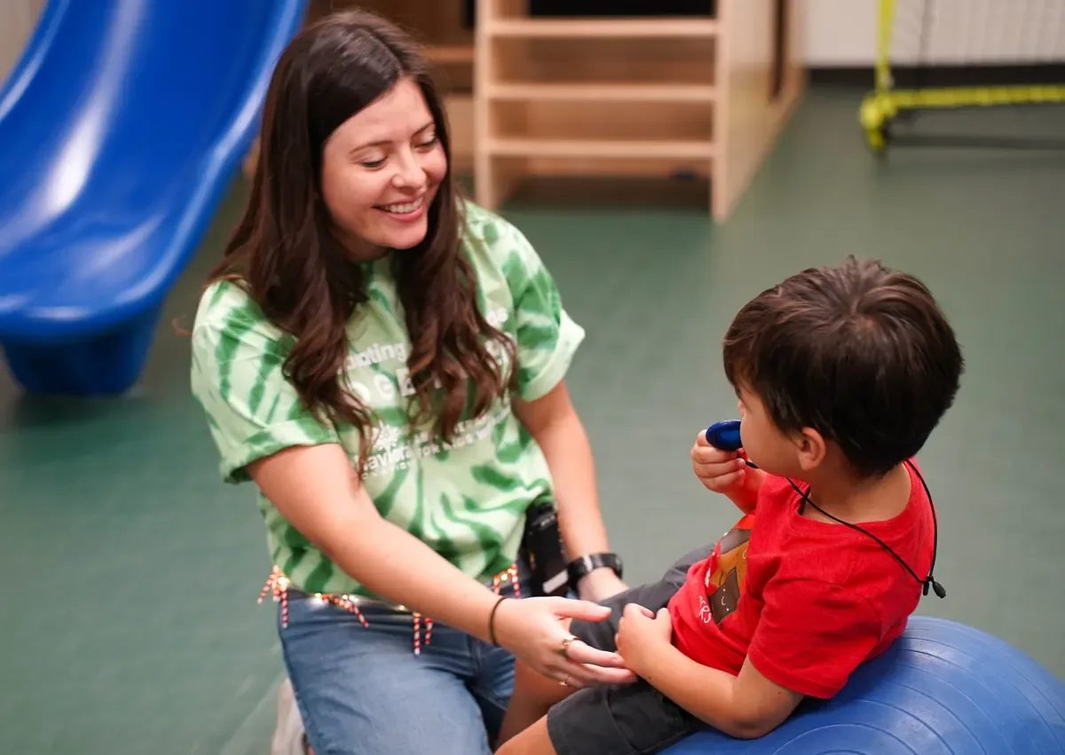 Provider-published image of a child and therapy staff