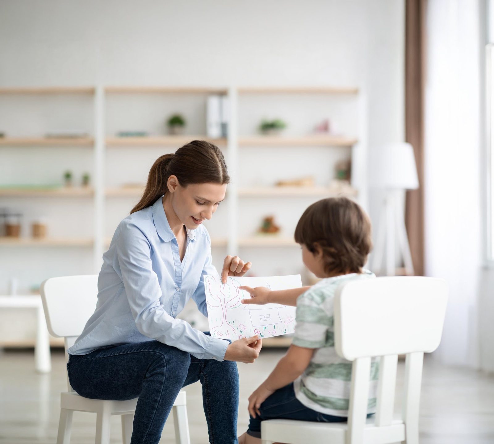 Therapist working with a child during an in-home ABA session in Missouri