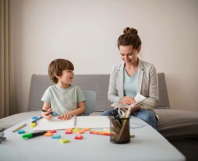 Therapist working with a child during in-home ABA therapy in Utah