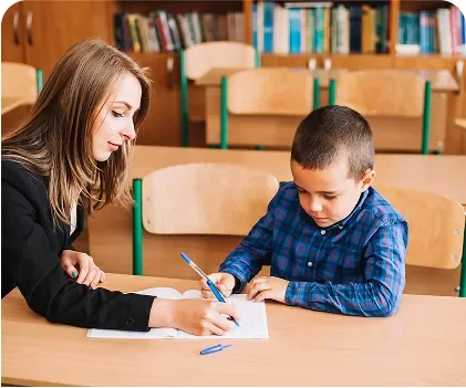 Adult helping a child with a writing activity