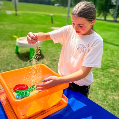 Child playing with a sensory activity outdoors