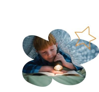 Child exploring a light-up activity during a Proud Moments ABA program