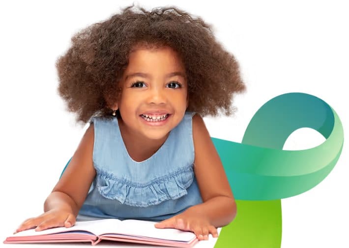 Smiling child reading a book beside an autism acceptance ribbon