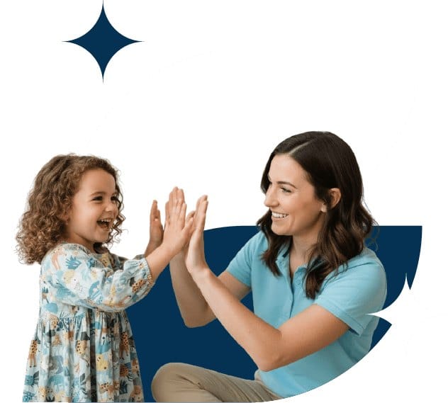 Therapist and child celebrating progress