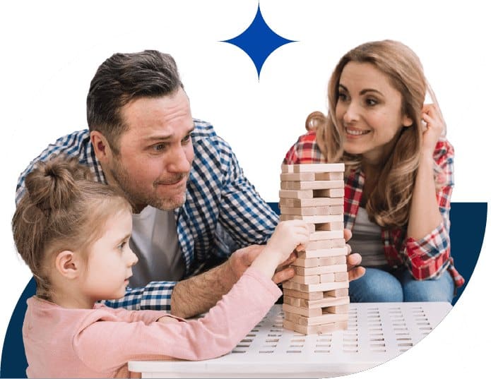Parents and child playing a stacking game