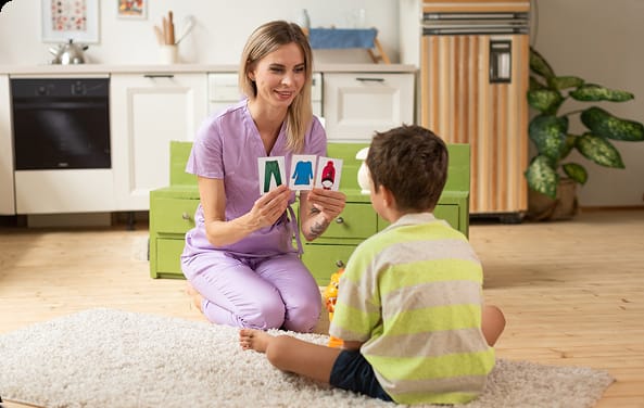 Therapist facilitating play-based learning and communication
