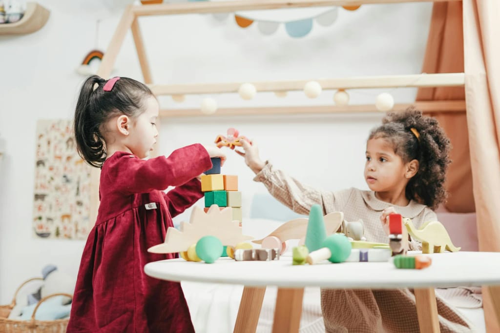 Two children taking part in a tabletop activity