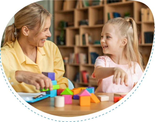 Adult and child playing with colorful blocks