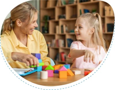 Adult and child playing with colorful blocks