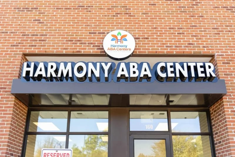 Exterior entrance and sign for Harmony ABA Centers in Katy, Texas